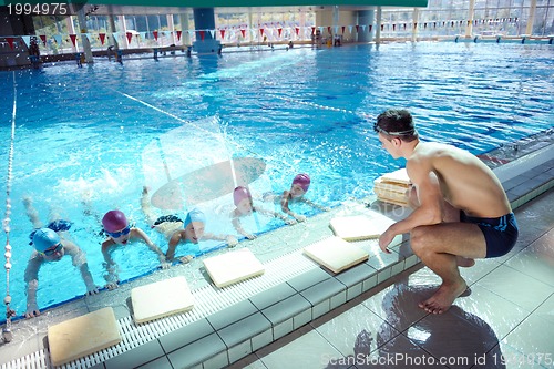 Image of happy child on swimming pool