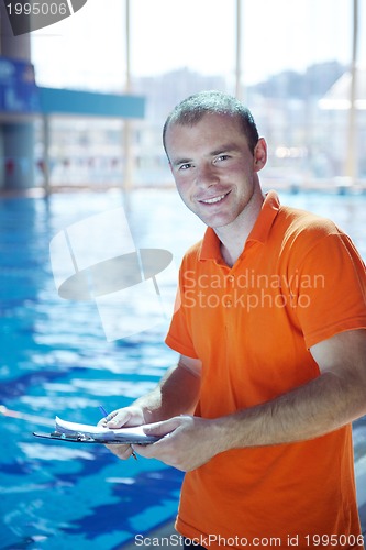 Image of happy child on swimming pool