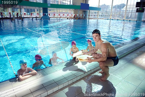 Image of happy child on swimming pool