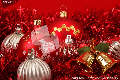 Image of Red christmas balls and decorations on red