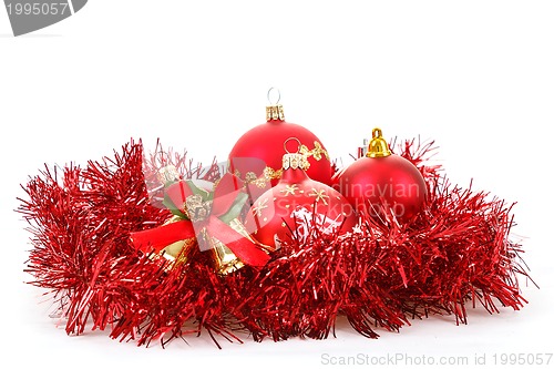 Image of Red christmas balls and decorations on white