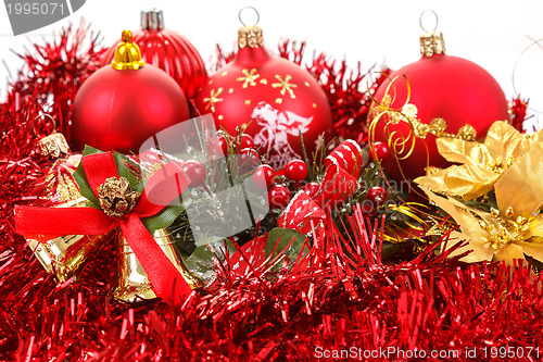 Image of Red christmas balls and decorations on white