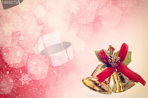 Image of red christmas background with golden bels