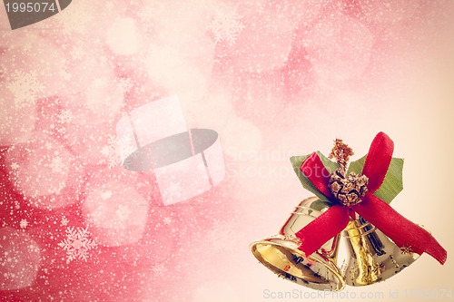 Image of red christmas background with golden bels