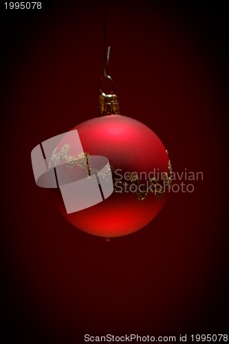 Image of red christmas ball on dark background