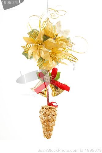 Image of christmas decoration with cone , bells and golden flower