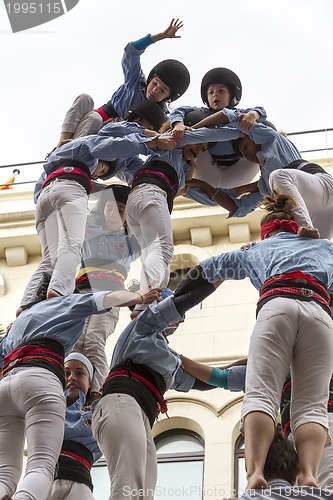 Image of Castellers, girls and drop-tower