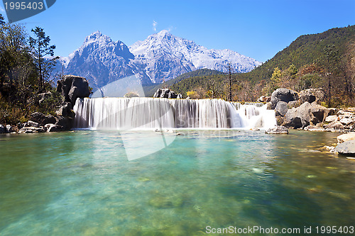 Image of Blue Moon Valley landscape in mountains of Lijiang, China. 