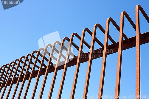 Image of Metal fence with bent rods