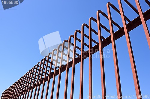 Image of Fence with bent metal rods