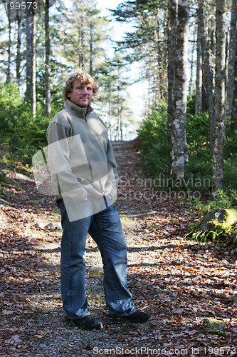 Image of Man taking a walk in a forest