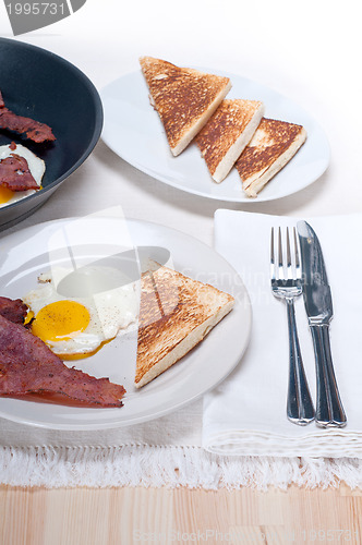 Image of eggs bacon and toast bread