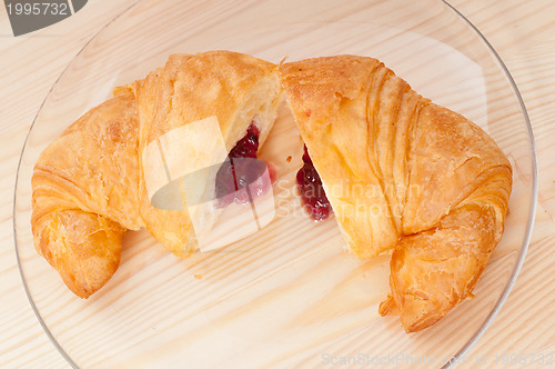 Image of croissant French brioche filled with berries jam