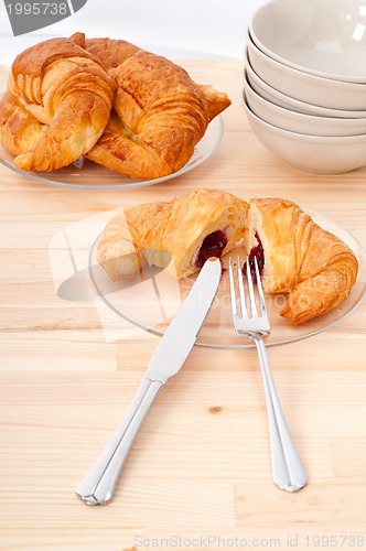 Image of croissant French brioche filled with berries jam