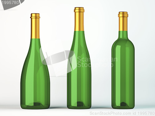 Image of Three green bottles for wine with golden labels 