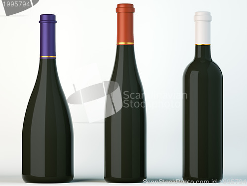 Image of Three corked black bottles for wine or beverages