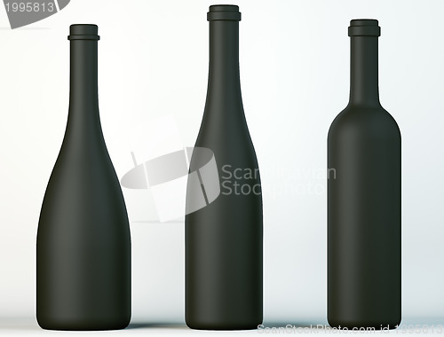 Image of Three uncorked black bottles for wine or beverages 