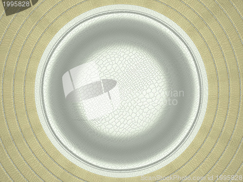 Image of Beige and white stitched circle shape on leather