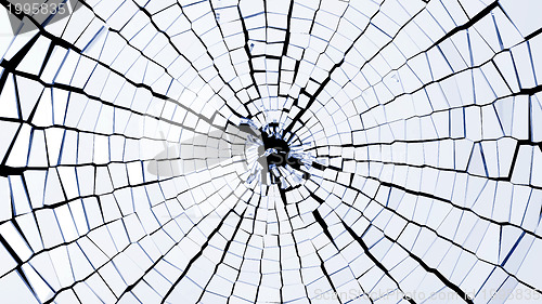 Image of Bullet hole: broken glass pieces