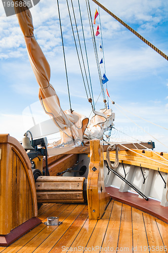 Image of ship's Bell and anchor lifting mechanism on an old sailboat 