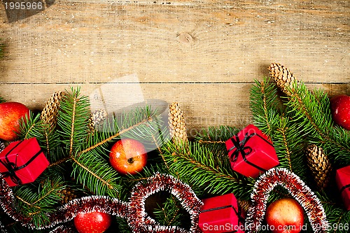 Image of christmas fir tree with pinecones, apples and decorations 