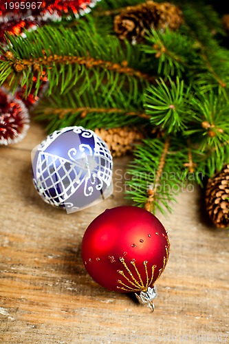 Image of christmas fir tree with pinecones and decorations 