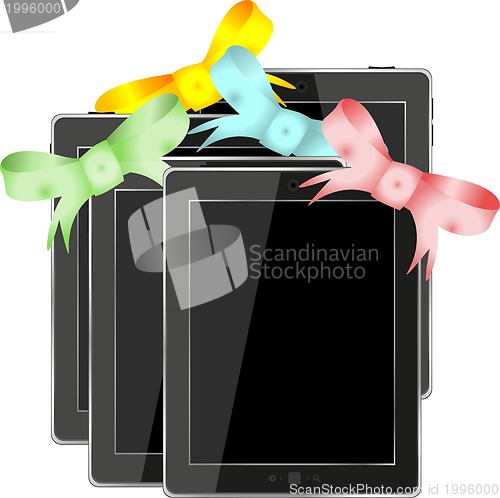 Image of Tablet pc set with ribbons and bow isolated on a white