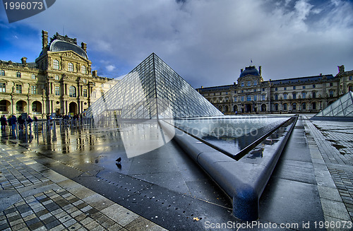 Image of PARIS - NOV 16: Louvre Pyramid reflects on Water on November, 16