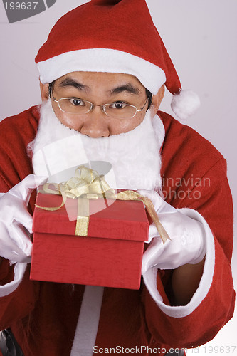 Image of Asian Santa Claus With Present