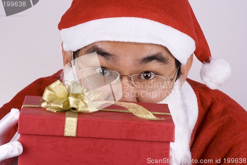 Image of Asian Santa Claus With Present