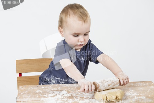 Image of child making cookies