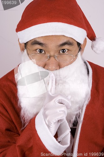 Image of Asian Santa Claus Whispering