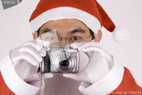 Image of Asian Santa Claus with Camera