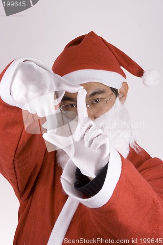Image of Asian Santa Claus With Framing Gesture