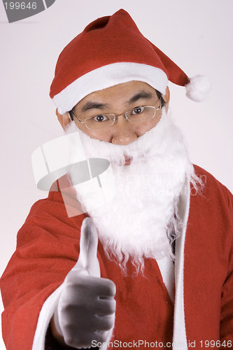 Image of Asian Santa Claus With Thumbs Up