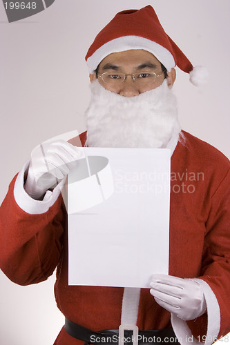 Image of Asian Santa Claus with blank paper