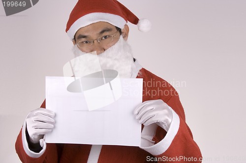 Image of Asian Santa Claus with blank paper