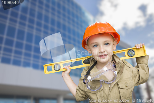 Image of Child Boy Dressed Up as Handyman in Front of Building