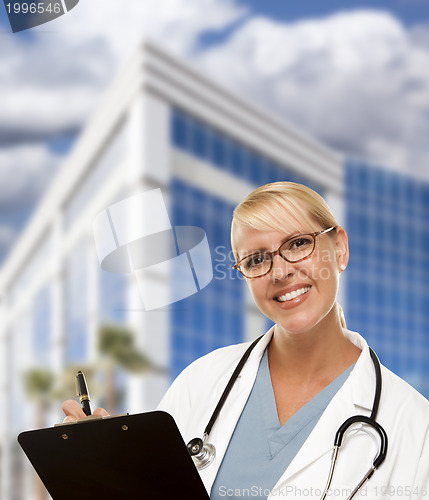 Image of Friendly Female Blonde Doctor or Nurse in Front of Building