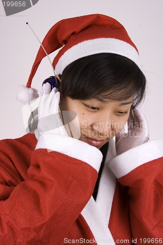 Image of Santa Claus Listening Music