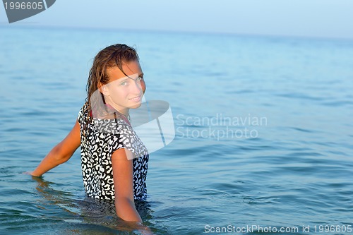 Image of nice teen girl in wet dress