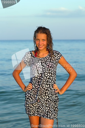 Image of smiling teen girl in wet dress