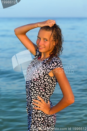 Image of attractive teen girl in wet dress