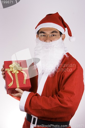 Image of Santa Claus Holding A Present