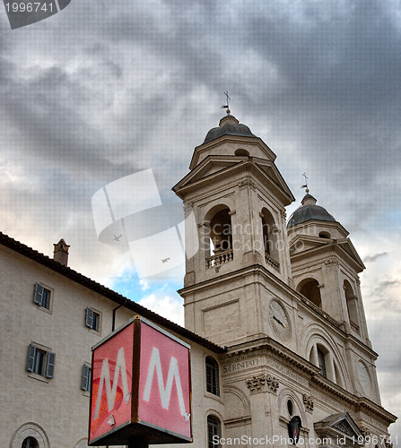 Image of Metro sign in Rome with Trinity Church in background