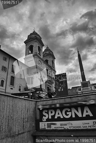 Image of Metro sign in Rome with Trinity Church in background
