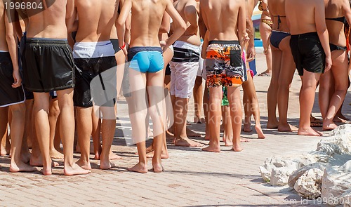 Image of summer crowd of young waiting peoples