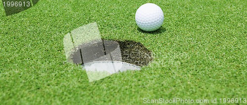 Image of Golf ball near the hole