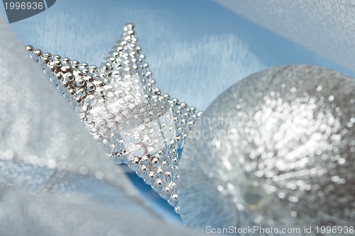 Image of christmas ball on blue silk