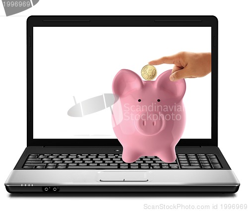Image of hand inserting a coin into a laptop